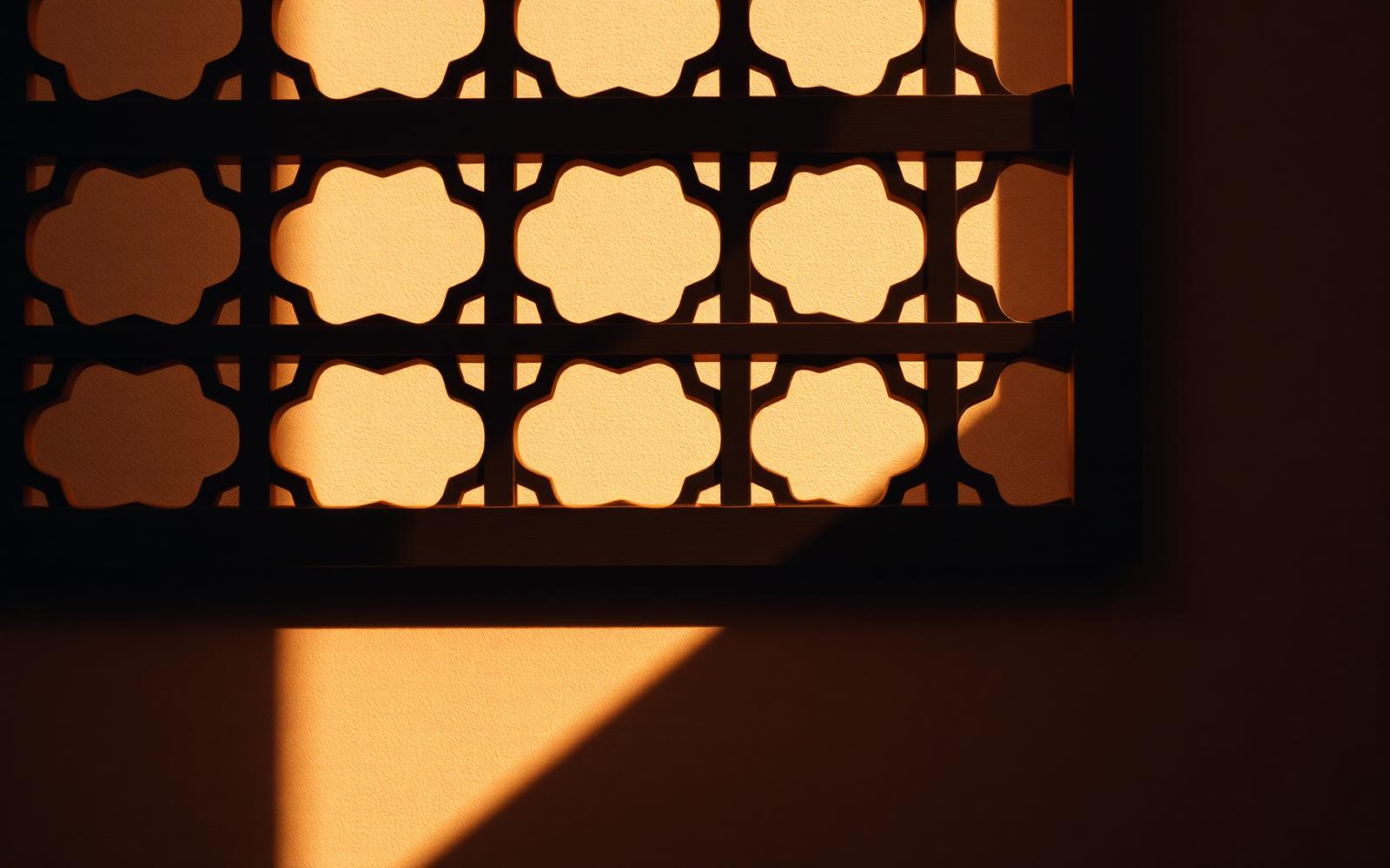 Warm afternoon light through a wooden lattice screen